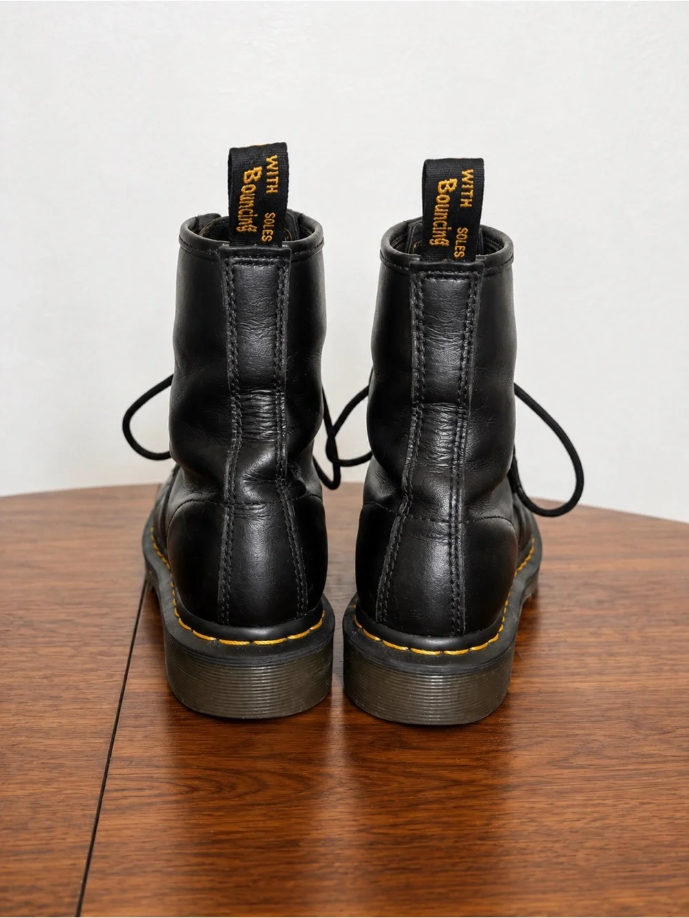 Dr. Martens Black Leather 8-Eye Lace-Up Boots with Yellow Stitching